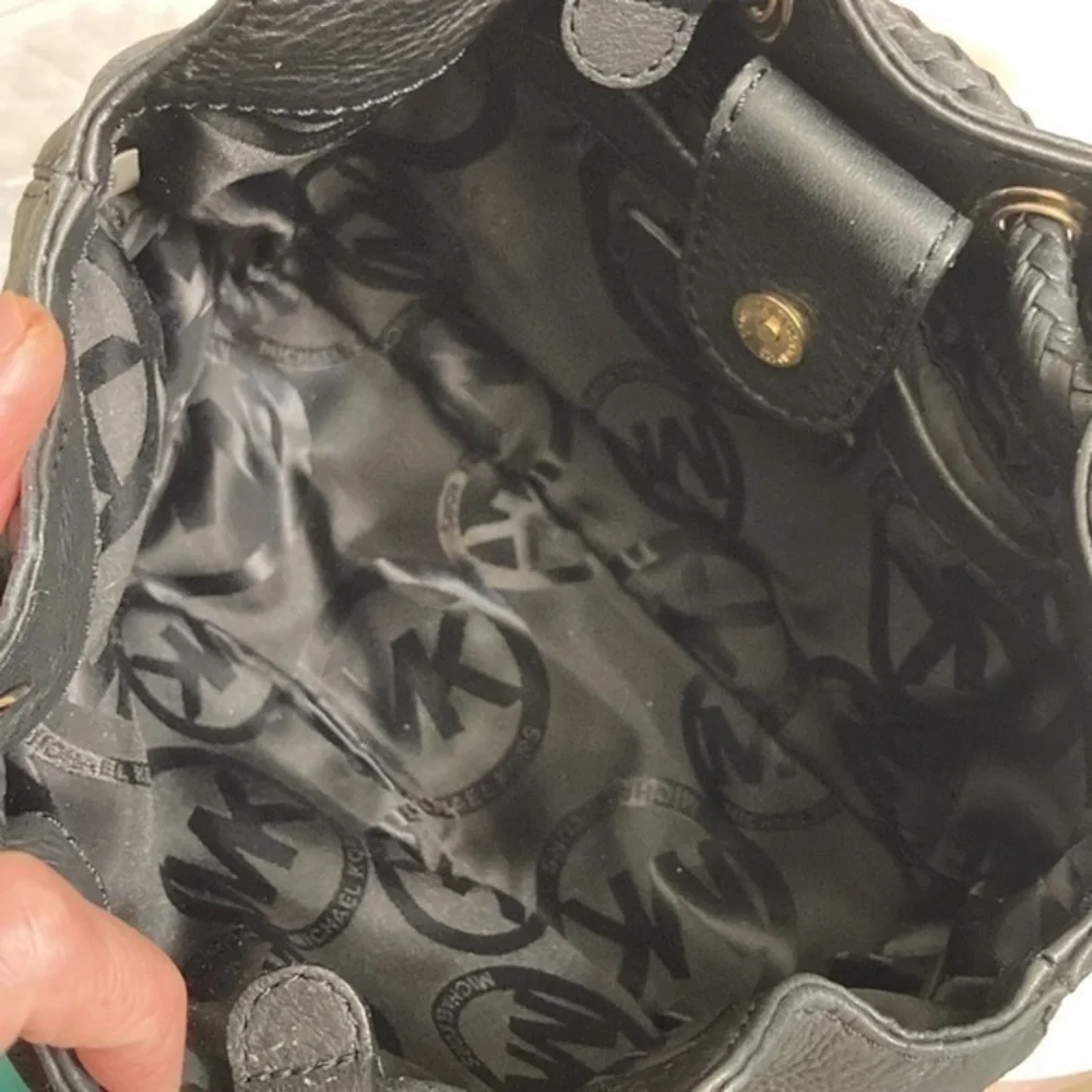 Michael kors mini black leather drawstring bag